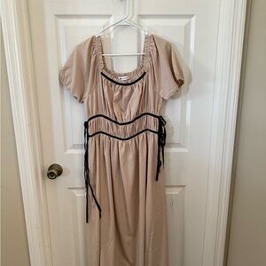 Elegant Beige Dress with Black Accents